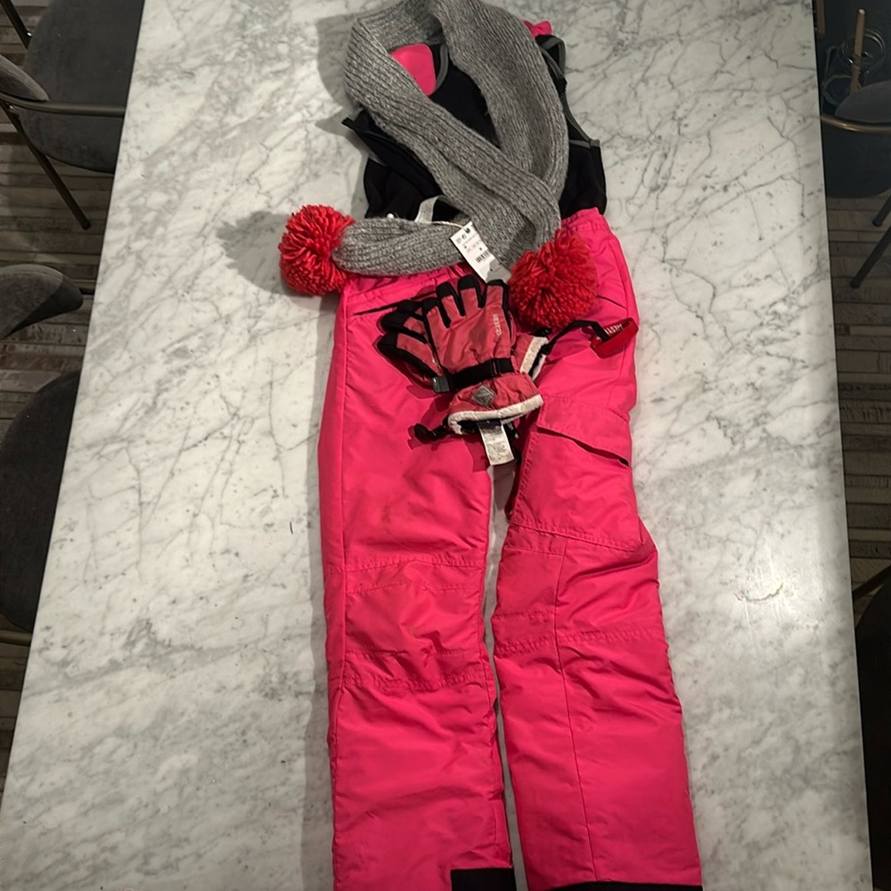 Pink ski jumpsuit (10/12), Zara scarf (M), and Hestra ski gloves (5)